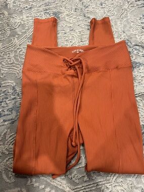Year of Ours Rust Orange Ribbed Lace-Up Leggings